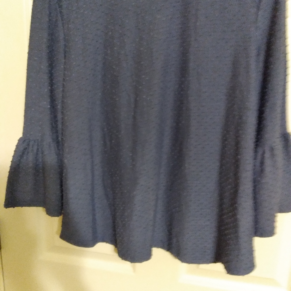 Soft flowy peplum top with 3/4 sleeves, back zipper,.size.large